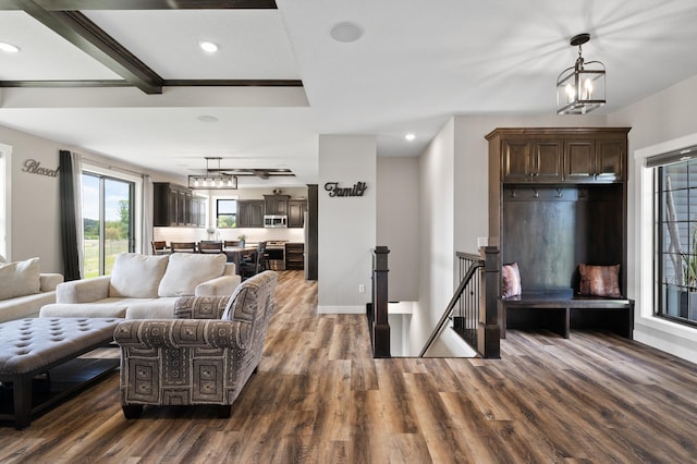 18885 Poppy St NW, Oak Grove, MN 55303 - living room featuring dark wood-style floors, a chandelier, recessed lighting, and baseboards