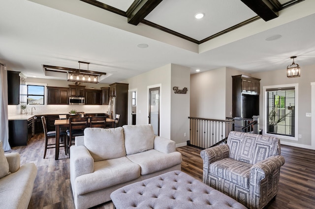 18885 Poppy St NW, Oak Grove, MN 55303 - living area with dark wood-style flooring, baseboards, crown molding, recessed lighting, and a chandelier