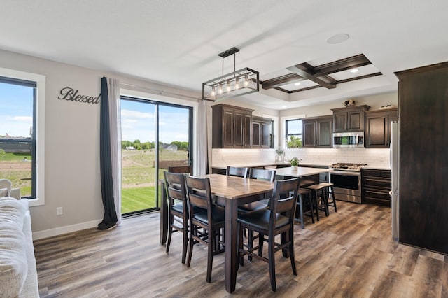 18885 Poppy St NW, Oak Grove, MN 55303 - dining area with wood finished floors, recessed lighting, baseboards, coffered ceiling, and beamed ceiling