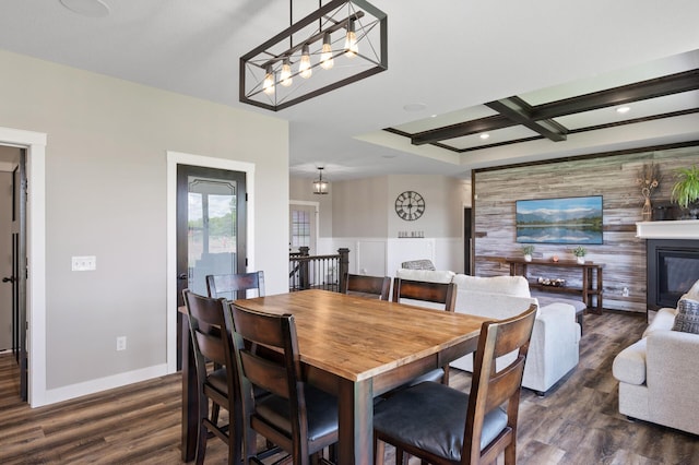 18885 Poppy St NW, Oak Grove, MN 55303 - dining room with dark wood finished floors, baseboards, a glass covered fireplace, coffered ceiling, and beam ceiling