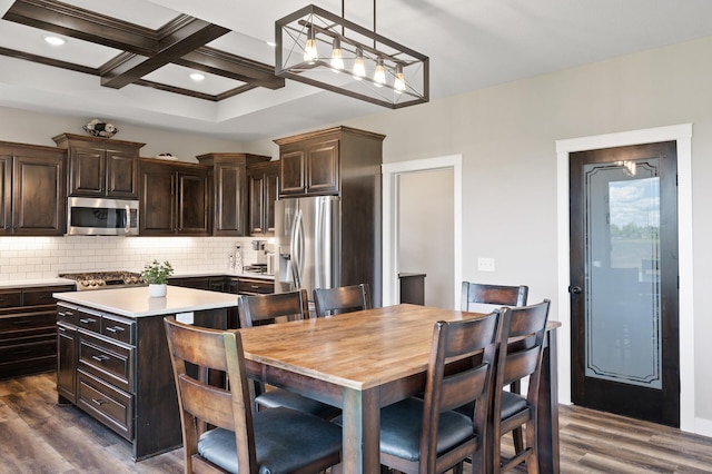 18885 Poppy St NW, Oak Grove, MN 55303 - kitchen featuring stainless steel appliances, light countertops, dark brown cabinets, dark wood finished floors, and backsplash