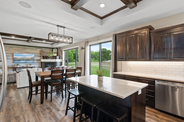 18885 Poppy St NW, Oak Grove, MN 55303 - kitchen with stainless steel dishwasher, light countertops, dark brown cabinetry, open floor plan, and beam ceiling