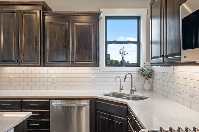 18885 Poppy St NW, Oak Grove, MN 55303 - kitchen with appliances with stainless steel finishes, a sink, and dark brown cabinetry
