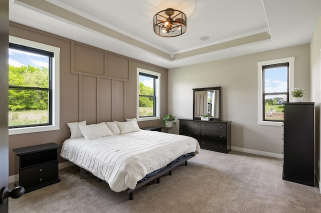 18885 Poppy St NW, Oak Grove, MN 55303 - carpeted bedroom with a raised ceiling, baseboards, and a chandelier