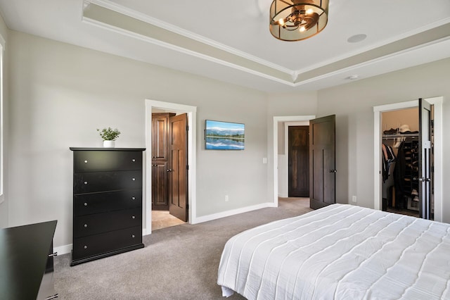 18885 Poppy St NW, Oak Grove, MN 55303 - bedroom featuring a chandelier, carpet floors, crown molding, a tray ceiling, and a spacious closet