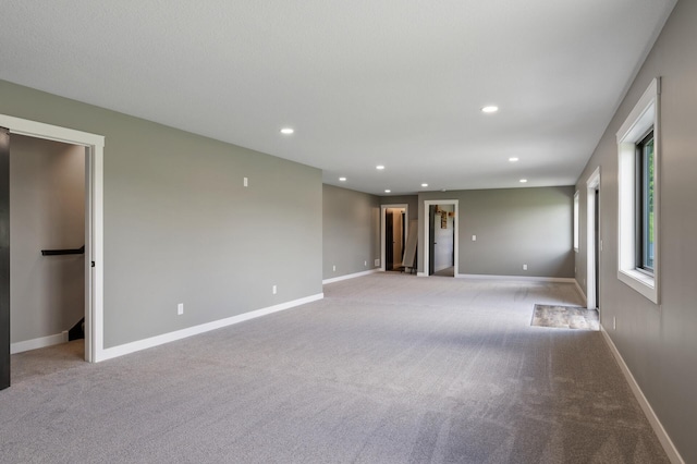 18885 Poppy St NW, Oak Grove, MN 55303 - carpeted empty room featuring recessed lighting and baseboards