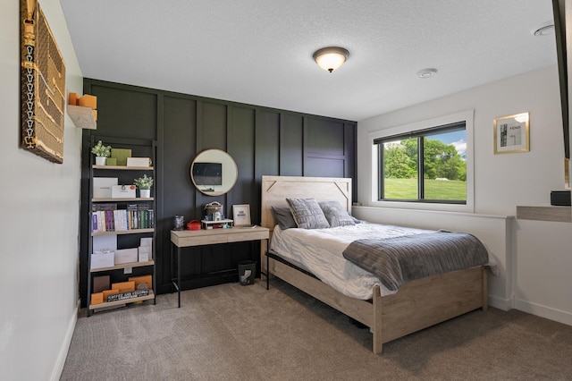 18885 Poppy St NW, Oak Grove, MN 55303 - carpeted bedroom with baseboards and a decorative wall