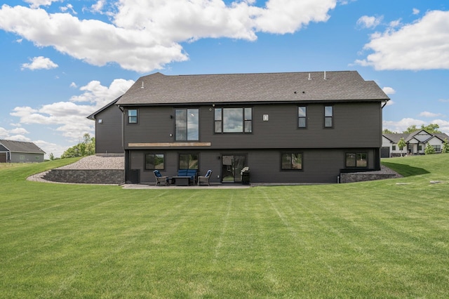 18885 Poppy St NW, Oak Grove, MN 55303 - rear view of property featuring a patio area, a lawn, and a shingled roof