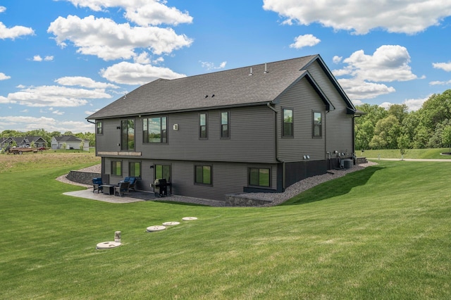 18885 Poppy St NW, Oak Grove, MN 55303 - rear view of property featuring a patio, a yard, central air condition unit, and a shingled roof