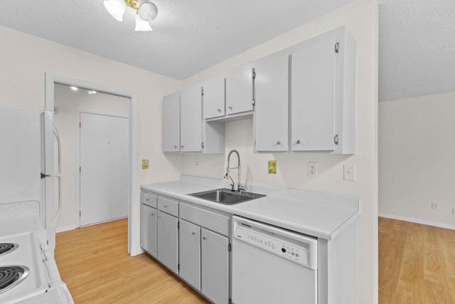 10113 34th St Unit 105, Minnetonka, MN 55305 - kitchen with white appliances, a sink, light wood-type flooring, a textured ceiling, and light countertops