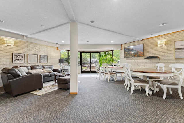10113 34th St Unit 105, Minnetonka, MN 55305 - living area with carpet, brick wall, and a textured ceiling