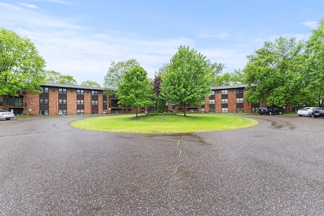 10113 34th St Unit 105, Minnetonka, MN 55305 - view of front facade with brick siding and a front lawn