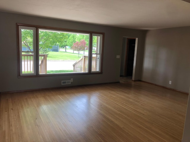 1304 13th Ave N, Moorhead, MN 56560 - spare room featuring wood finished floors and baseboards