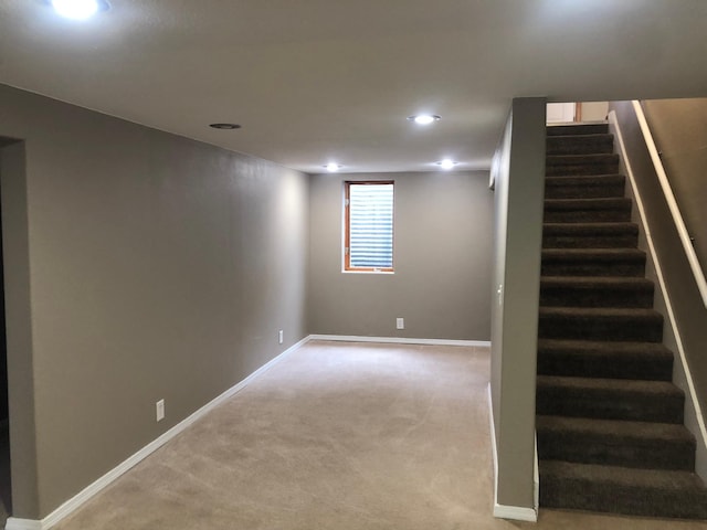 1304 13th Ave N, Moorhead, MN 56560 - below grade area with stairs, recessed lighting, light carpet, and baseboards