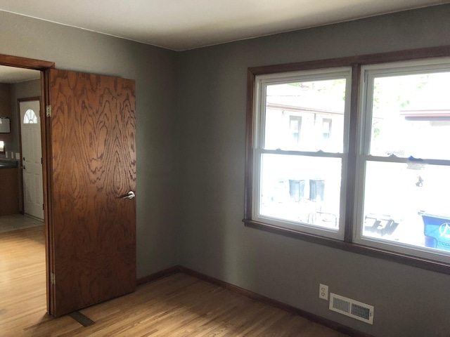 1304 13th Ave N, Moorhead, MN 56560 - empty room with light wood-style floors and baseboards