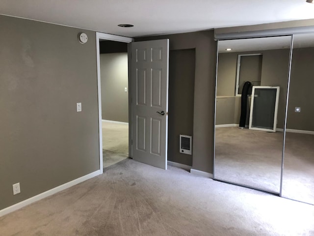 1304 13th Ave N, Moorhead, MN 56560 - unfurnished bedroom with carpet, baseboards, and heating unit