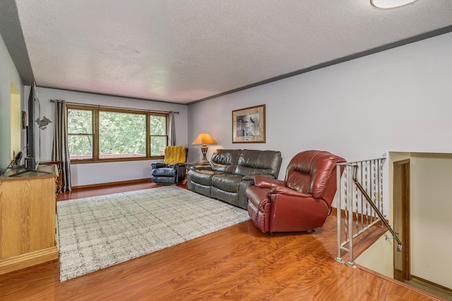 1357 64th Ave NE, Fridley, MN 55432 - living room featuring a textured ceiling and wood finished floors