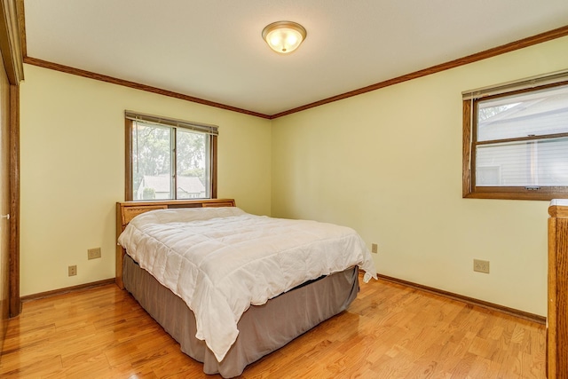 1357 64th Ave NE, Fridley, MN 55432 - bedroom featuring light wood-style flooring and crown molding