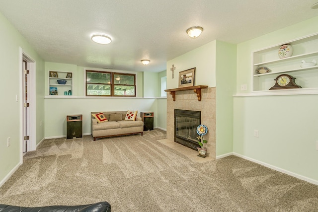 1357 64th Ave NE, Fridley, MN 55432 - living room featuring carpet floors, a textured ceiling, a tile fireplace, and built in features