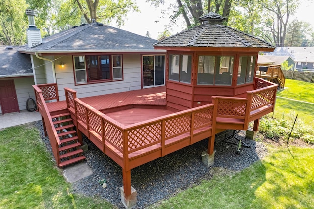 1357 64th Ave NE, Fridley, MN 55432 - rear view of property featuring a chimney, a deck, and stairway