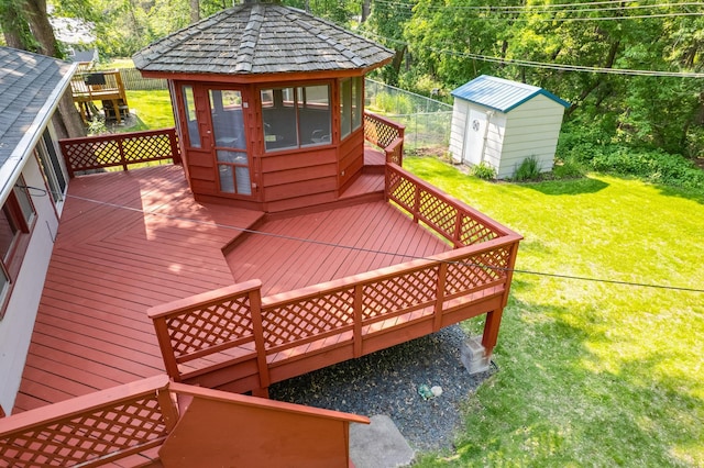 1357 64th Ave NE, Fridley, MN 55432 - wooden terrace featuring a storage unit