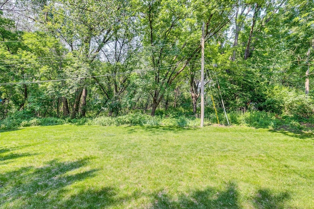 1357 64th Ave NE, Fridley, MN 55432 - view of grassy yard with a view of trees
