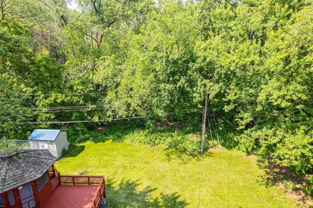 1357 64th Ave NE, Fridley, MN 55432 - view of grassy yard with a shed and a deck