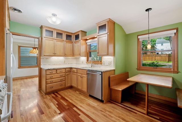 4932 Cedar Ave S, Minneapolis, MN 55417 - kitchen with dishwasher, light wood finished floors, backsplash, and plenty of natural light