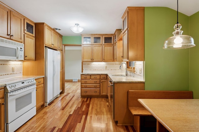 4932 Cedar Ave S, Minneapolis, MN 55417 - kitchen featuring white appliances, light wood finished floors, tasteful backsplash, and pendant lighting
