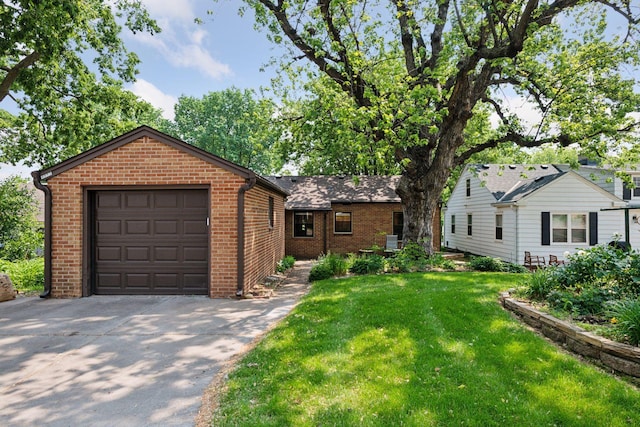 4932 Cedar Ave S, Minneapolis, MN 55417 - ranch-style home featuring driveway, brick siding, a front yard, and a garage