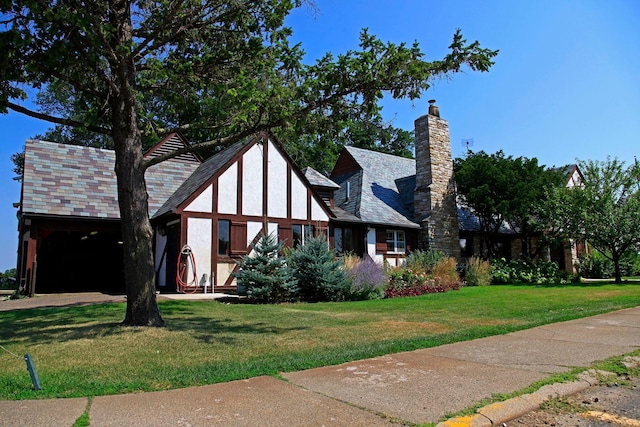 4932 Cedar Ave S, Minneapolis, MN 55417 - tudor house with a front yard, a chimney, and stucco siding