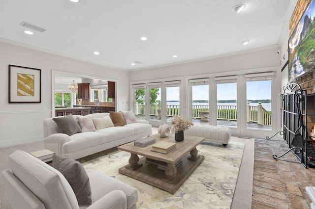 2645 Arcola Ln, Minnetonka Beach, MN 55391 - living area with crown molding, a chandelier, recessed lighting, and a water view