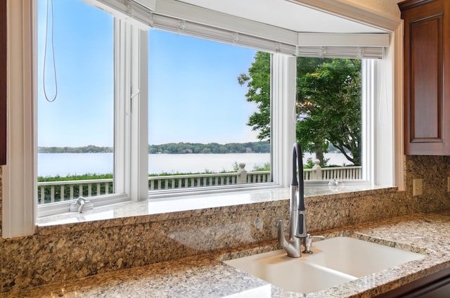 2645 Arcola Ln, Minnetonka Beach, MN 55391 - kitchen featuring a water view, tasteful backsplash, and light stone counters