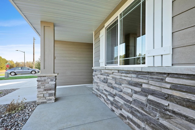10014 177th Ave NW, Elk River, MN 55330 - doorway to property with covered porch and stone siding