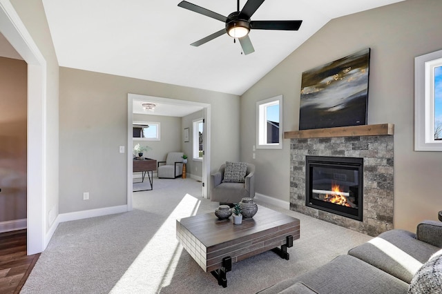 10014 177th Ave NW, Elk River, MN 55330 - living area featuring a fireplace, ceiling fan, baseboards, lofted ceiling, and carpet flooring