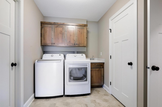 10014 177th Ave NW, Elk River, MN 55330 - laundry room with cabinet space, independent washer and dryer, and baseboards