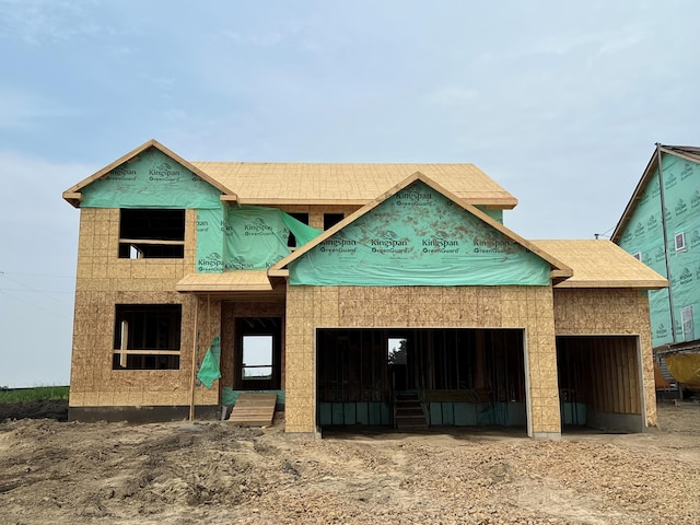 1948 Tamarack Rd, Carver, MN 55315 - unfinished property featuring a garage and dirt driveway