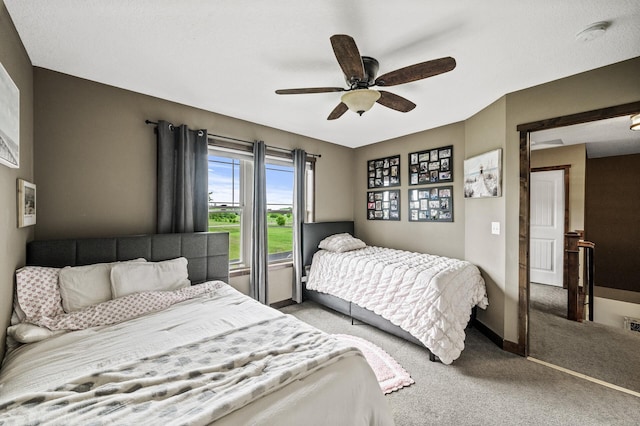 26042 Sunset Dr, Chisago City, MN 55013 - carpeted bedroom featuring a ceiling fan and baseboards