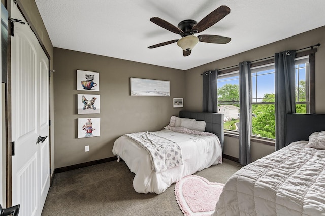 26042 Sunset Dr, Chisago City, MN 55013 - carpeted bedroom with baseboards, a closet, and ceiling fan