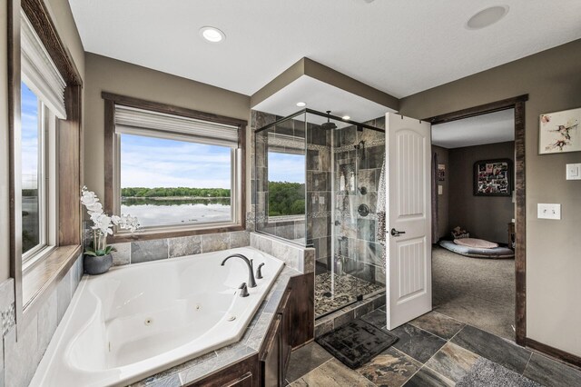 26042 Sunset Dr, Chisago City, MN 55013 - full bath featuring a shower stall, a tub with jets, baseboards, and recessed lighting