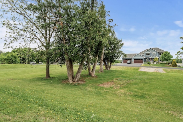 26042 Sunset Dr, Chisago City, MN 55013 - view of grassy yard with an attached garage and driveway