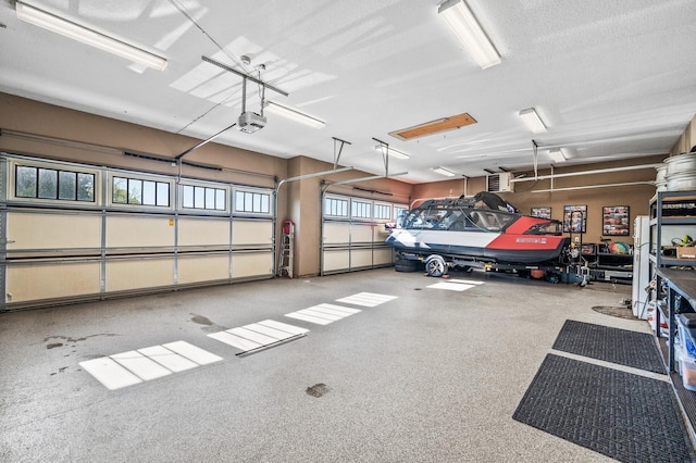 26042 Sunset Dr, Chisago City, MN 55013 - garage featuring a garage door opener