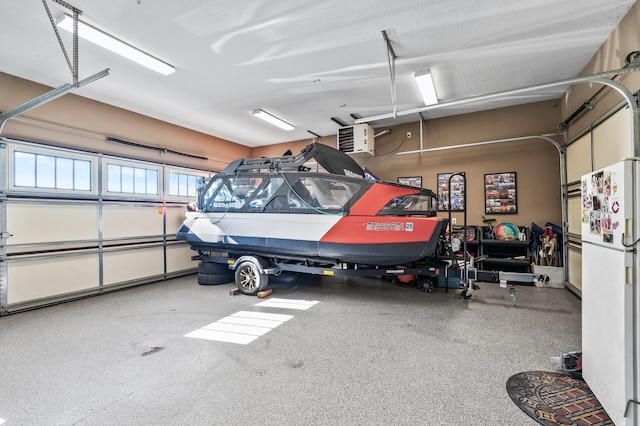 26042 Sunset Dr, Chisago City, MN 55013 - garage featuring freestanding refrigerator and a heating unit