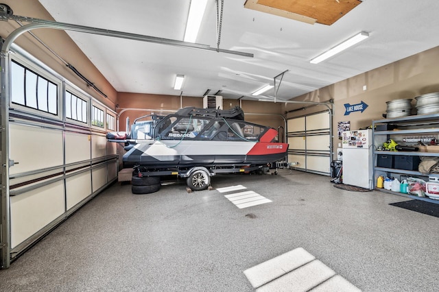 26042 Sunset Dr, Chisago City, MN 55013 - garage featuring freestanding refrigerator