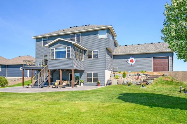 26042 Sunset Dr, Chisago City, MN 55013 - rear view of property with a wooden deck, a patio, a yard, and stairway