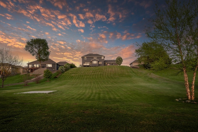 26042 Sunset Dr, Chisago City, MN 55013 - yard at dusk featuring a yard