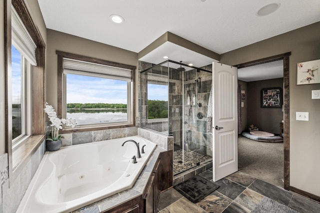 26042 Sunset Dr, Chisago City, MN 55013 - full bathroom with a shower stall, a jetted tub, and recessed lighting