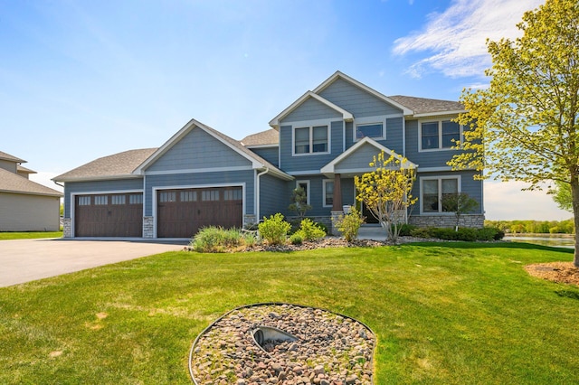 26042 Sunset Dr, Chisago City, MN 55013 - craftsman-style home with stone siding, concrete driveway, a garage, and a front yard