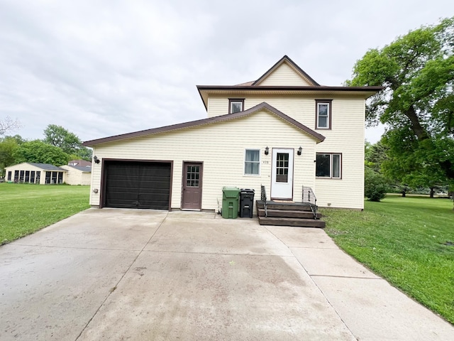 408 Lafayette Ave, Fulda, MN 56131 - traditional home with an attached garage, concrete driveway, and a front lawn