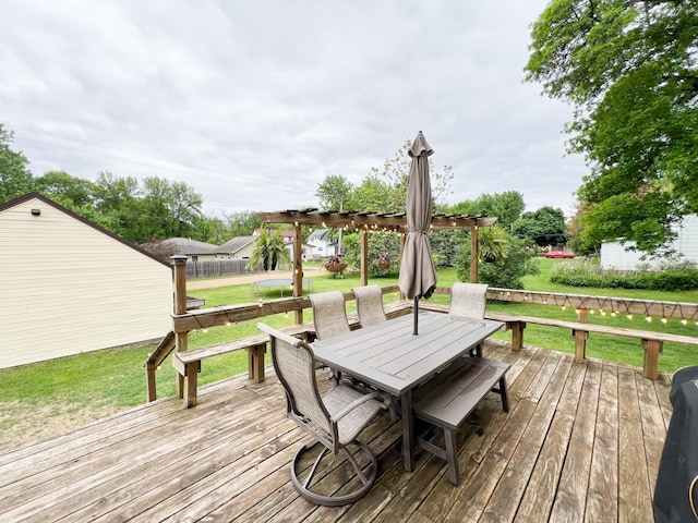 408 Lafayette Ave, Fulda, MN 56131 - wooden deck featuring outdoor dining area, a lawn, and a pergola